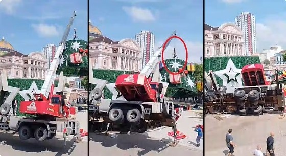Guindaste tomba ao montar árvore de natal e mata trabalhador